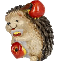 Igel mit zwei Äpfeln, gebückt